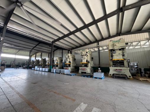 A row of stamping machines on the shop floor